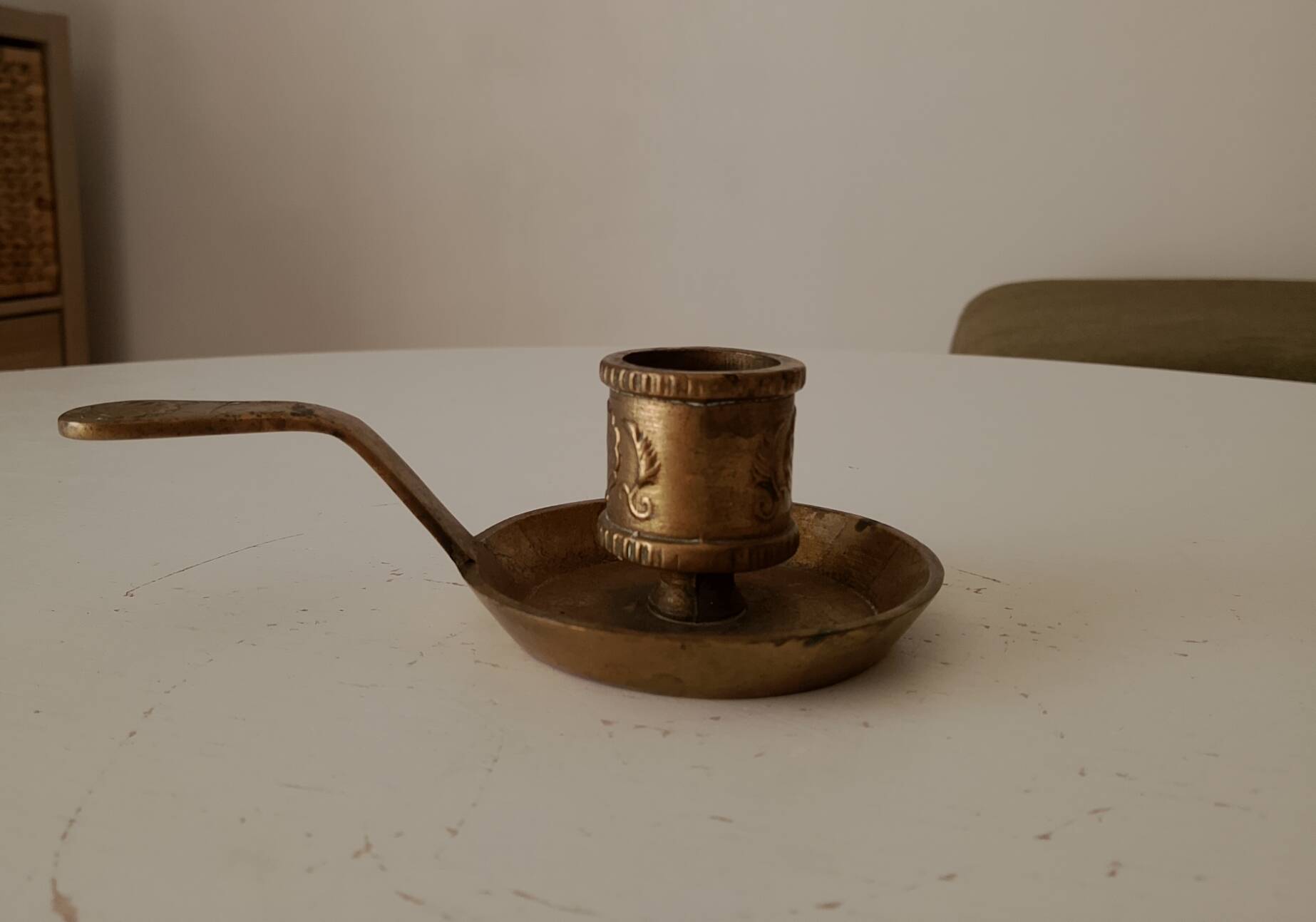 Antique hand-held candlestick in gilded bronze