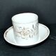 Paris porcelain coffee cup with floral design, antique porcelain with gold trim.