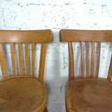 4 mismatched signed bistro chairs