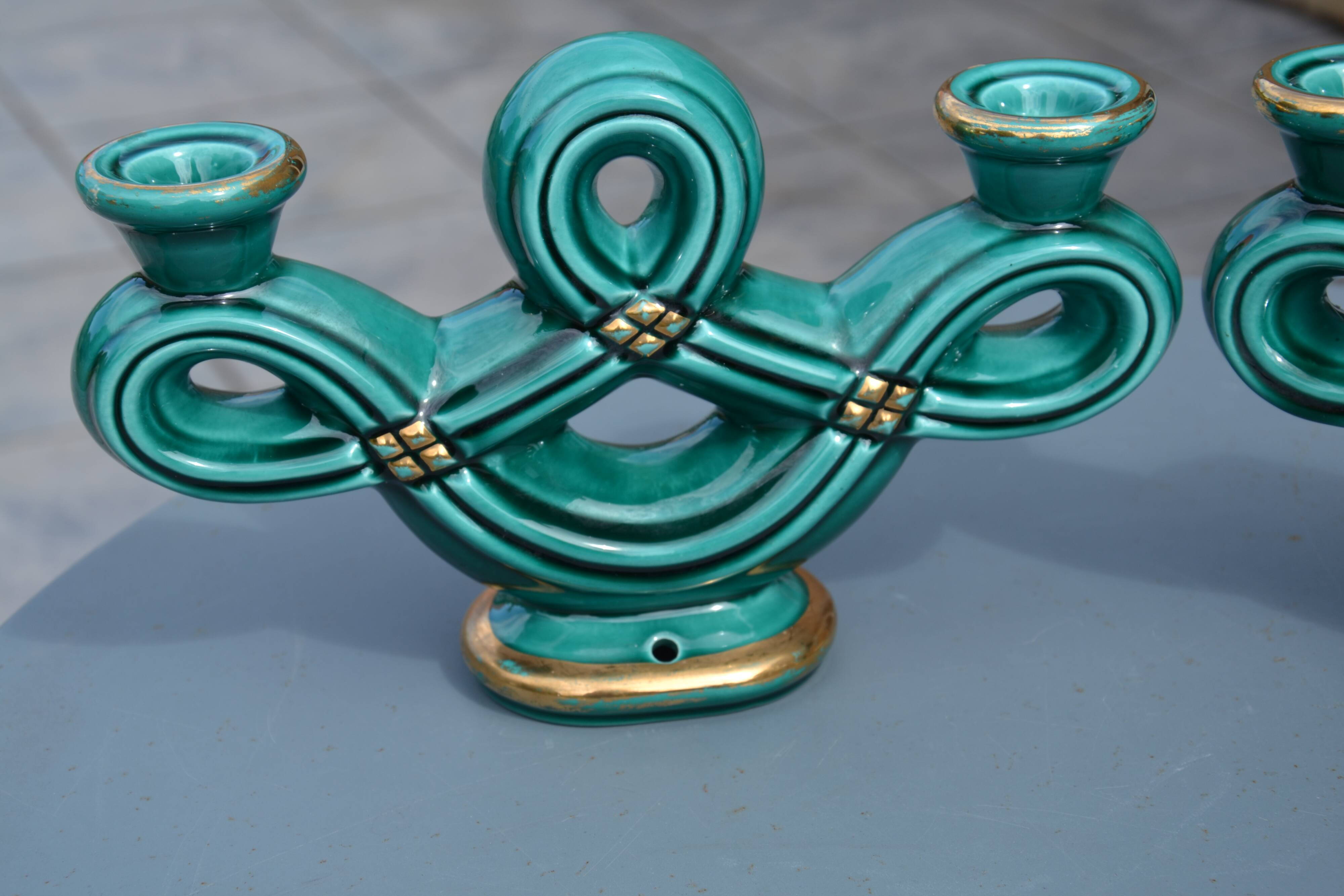 Two green ceramic candlesticks from the 1930s-1940s.