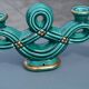 Two green ceramic candlesticks from the 1930s-1940s.