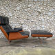 Lounge chair and ottoman black leather and teak multiplex, 1960