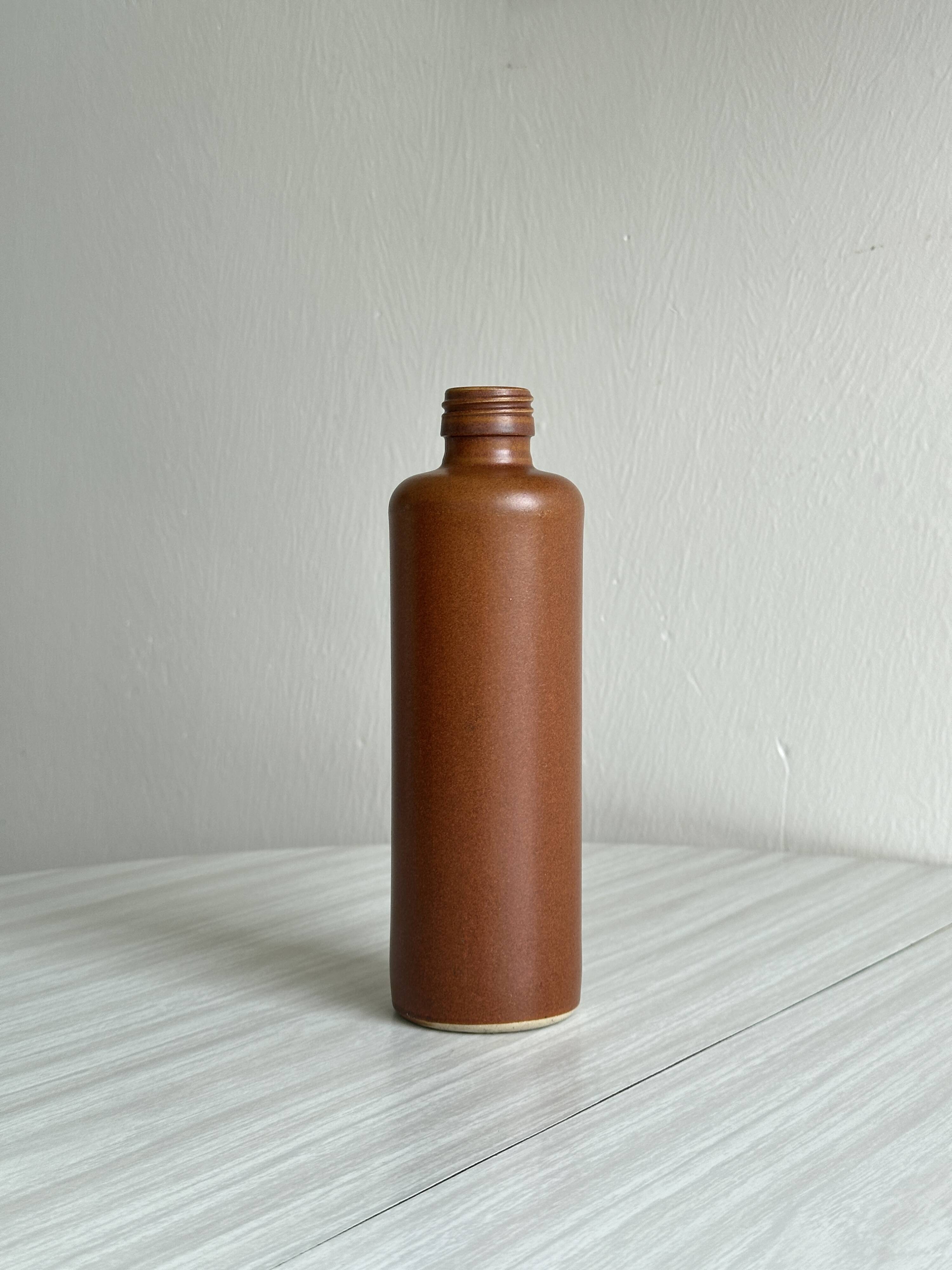 Decorative brown ceramic bottle.