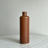 Decorative brown ceramic bottle.
