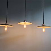 Trio of large industrial suspensions in green enamelled sheet metal.