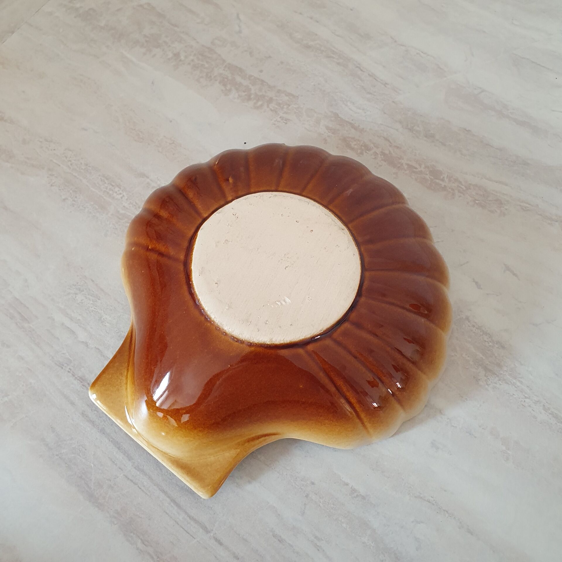 Brown and white ceramic shell bowl