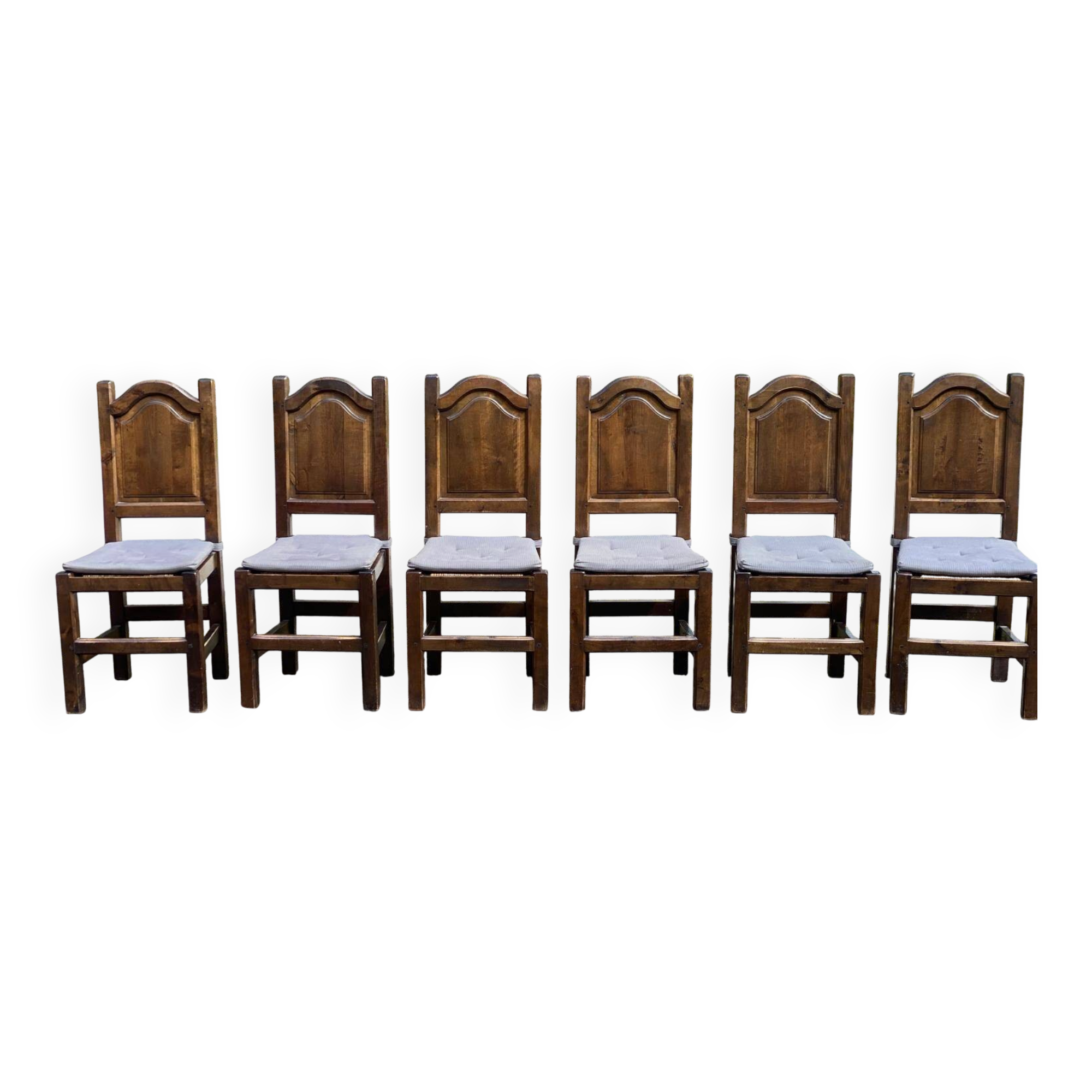 6 dining chairs in a country or farmhouse style, made of dark solid wood and rush-seated.