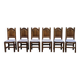 6 dining chairs in a country or farmhouse style, made of dark solid wood and rush-seated.