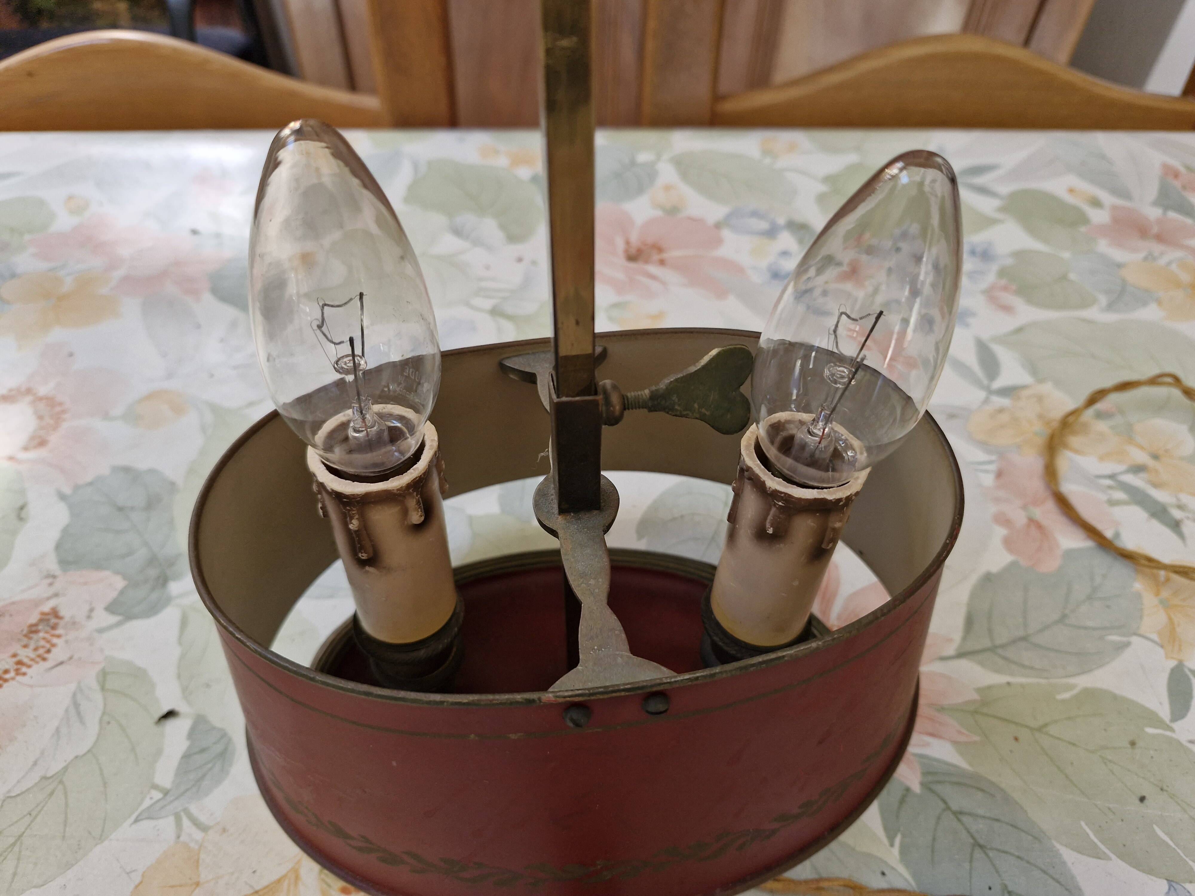 Old silver-plated bronze lamp, except for the arms which are not silver.