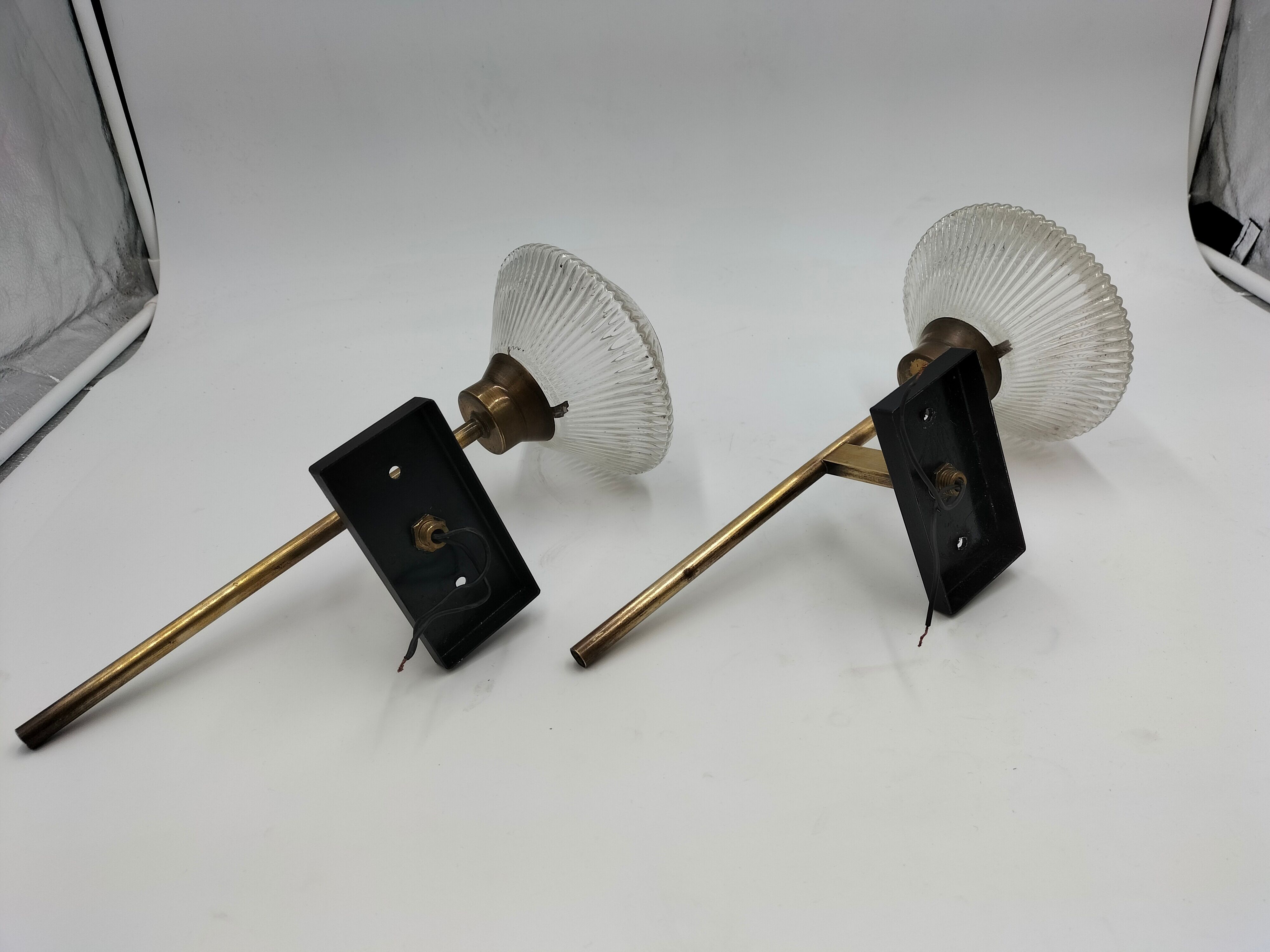 Pair of brass and glass wall lamps