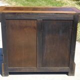 Chest of drawers with decorated handles in the Louis XVI style.