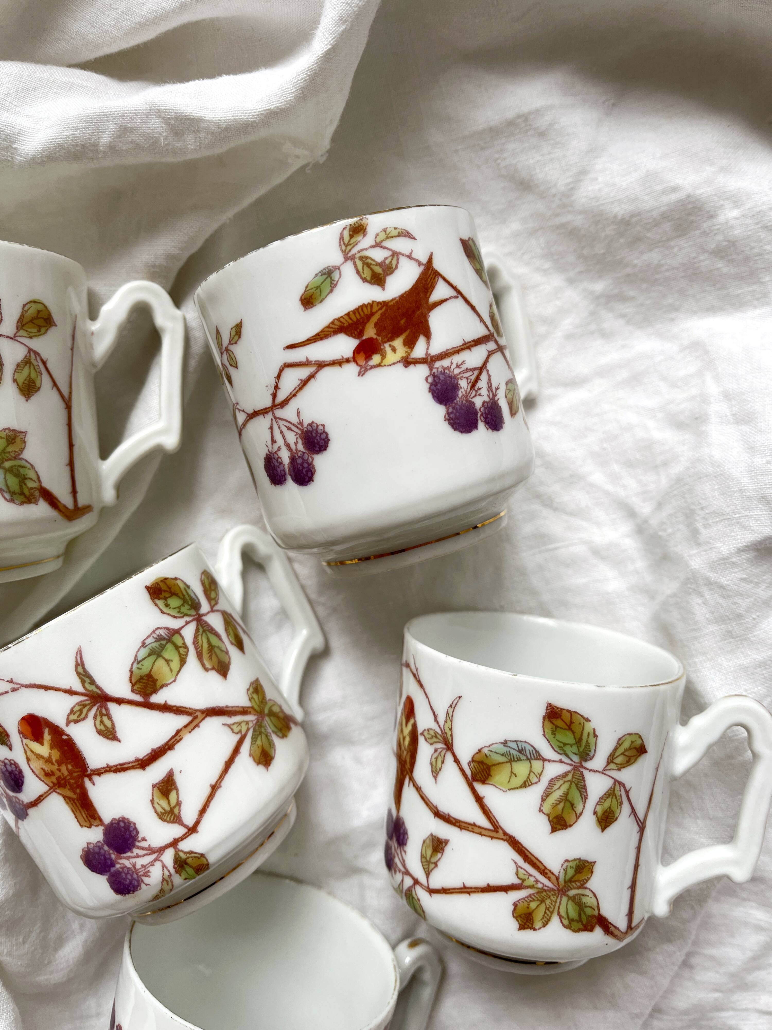 5 antique porcelain coffee cups decorated with birds