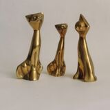 Trio of cats in gilded brass