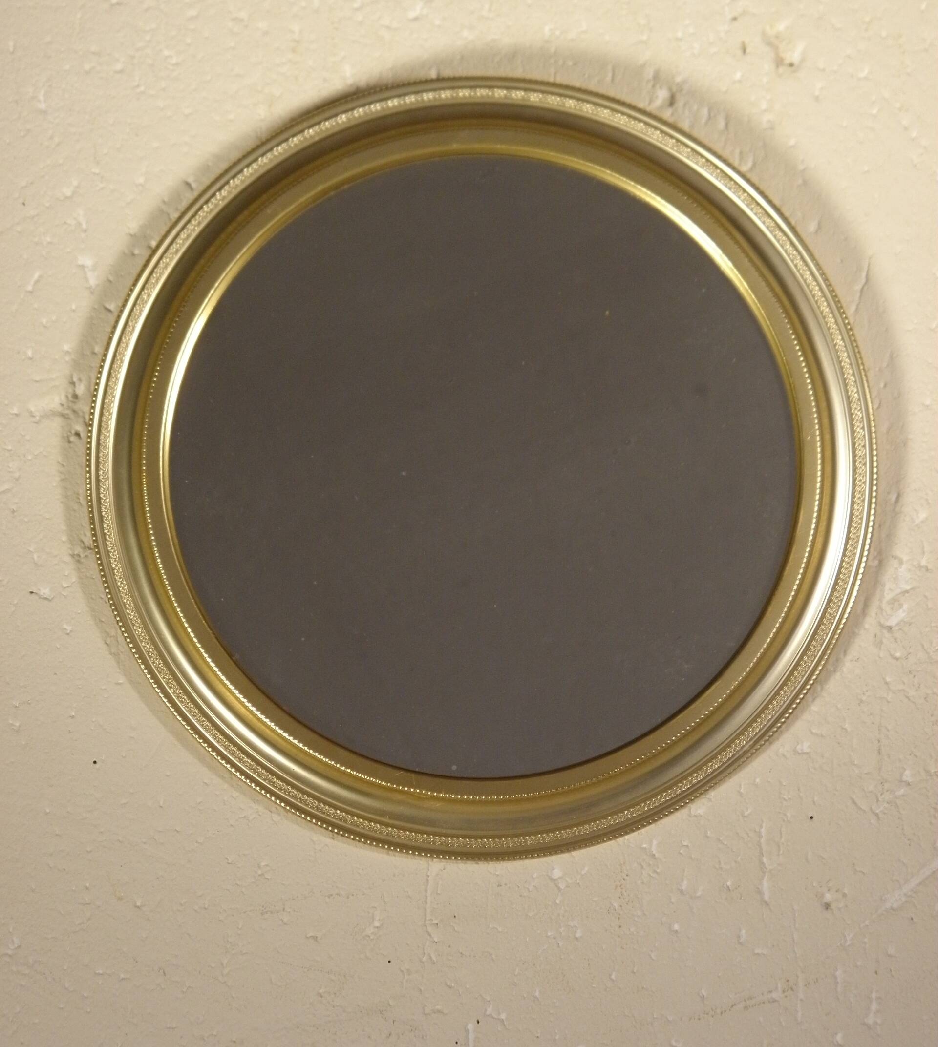 Round mirror in gilded metal 24 cm