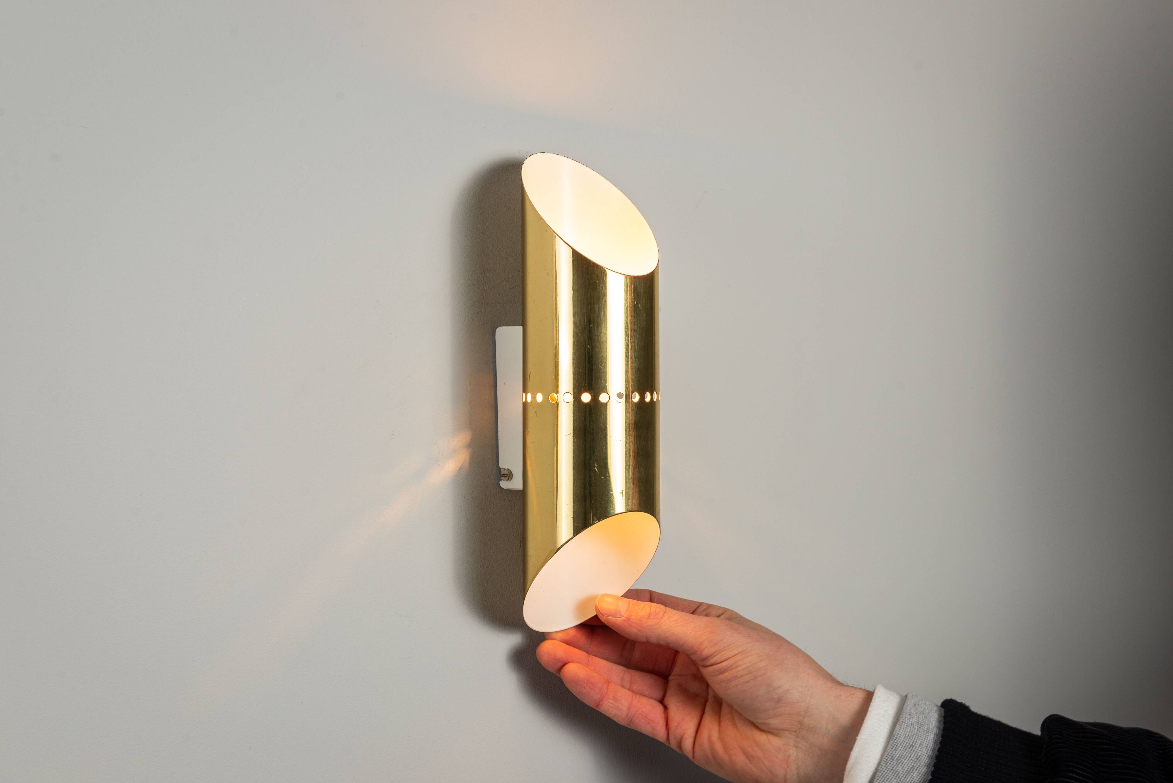 Pair of cylindrical wall lamps in brass with perforated shades