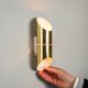 Pair of cylindrical wall lamps in brass with perforated shades