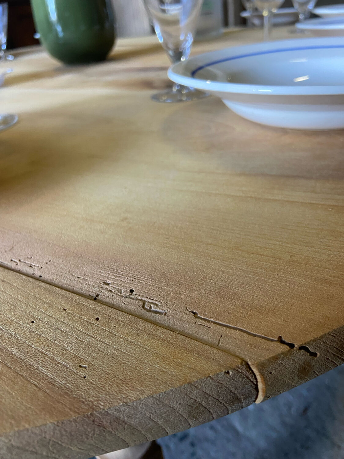 Oval wooden table on wheels.