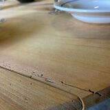 Oval wooden table on wheels.