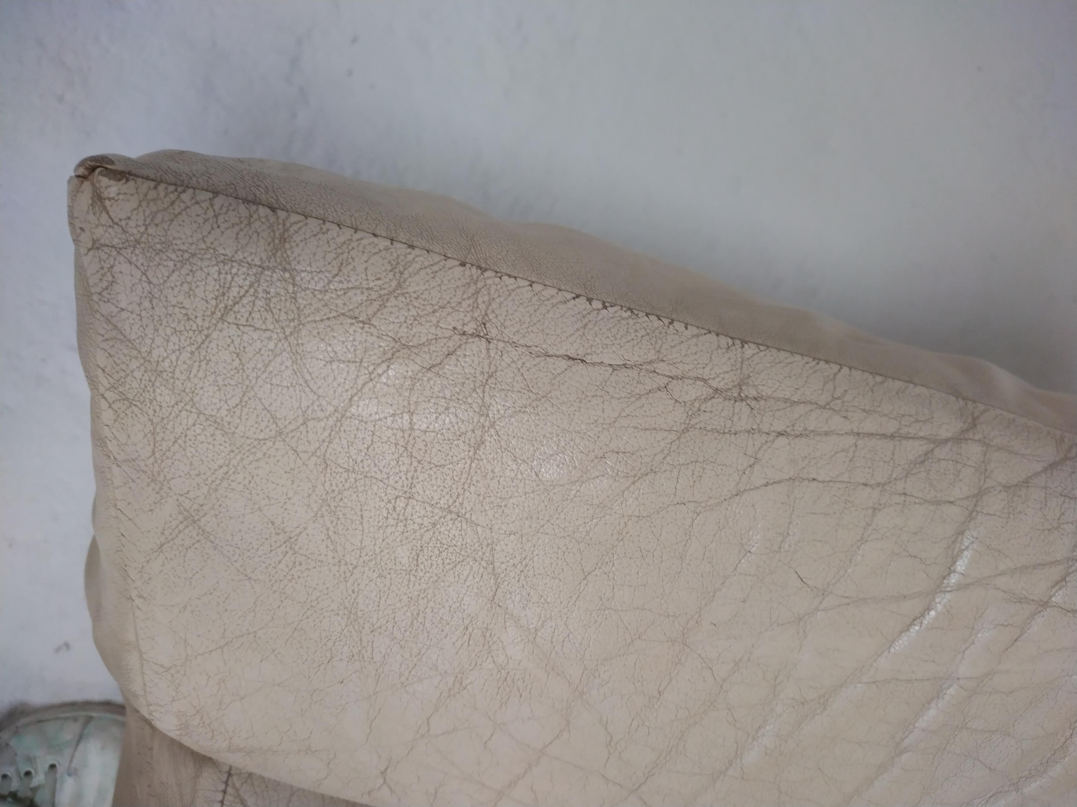 Leather armchair and cream-coloured foam, France , circa 1970