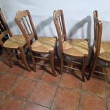 4 rustic farmhouse chairs made of wood and straw