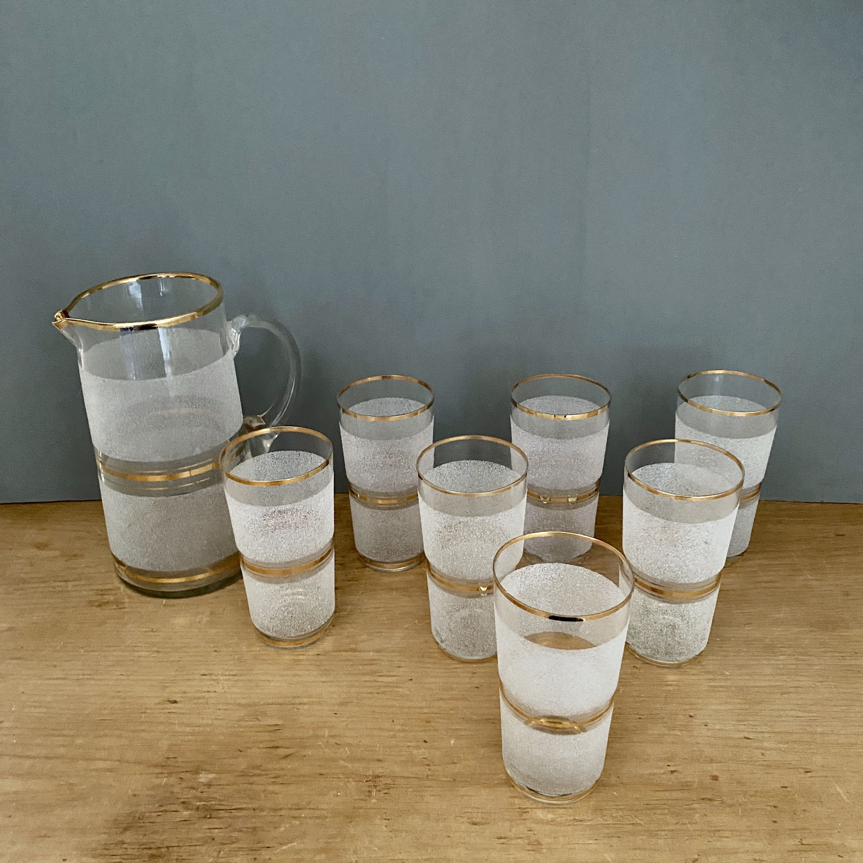 Vintage orangeade service in white granite glass and golden edging