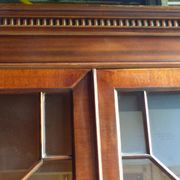Scribanne bookcase in mahogany veneer English work of the twentieth century