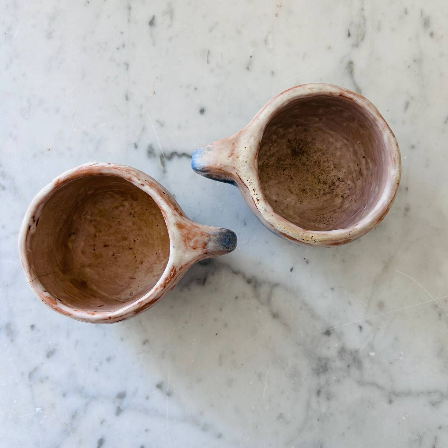 Set of artisanal pitcher and weathered cups