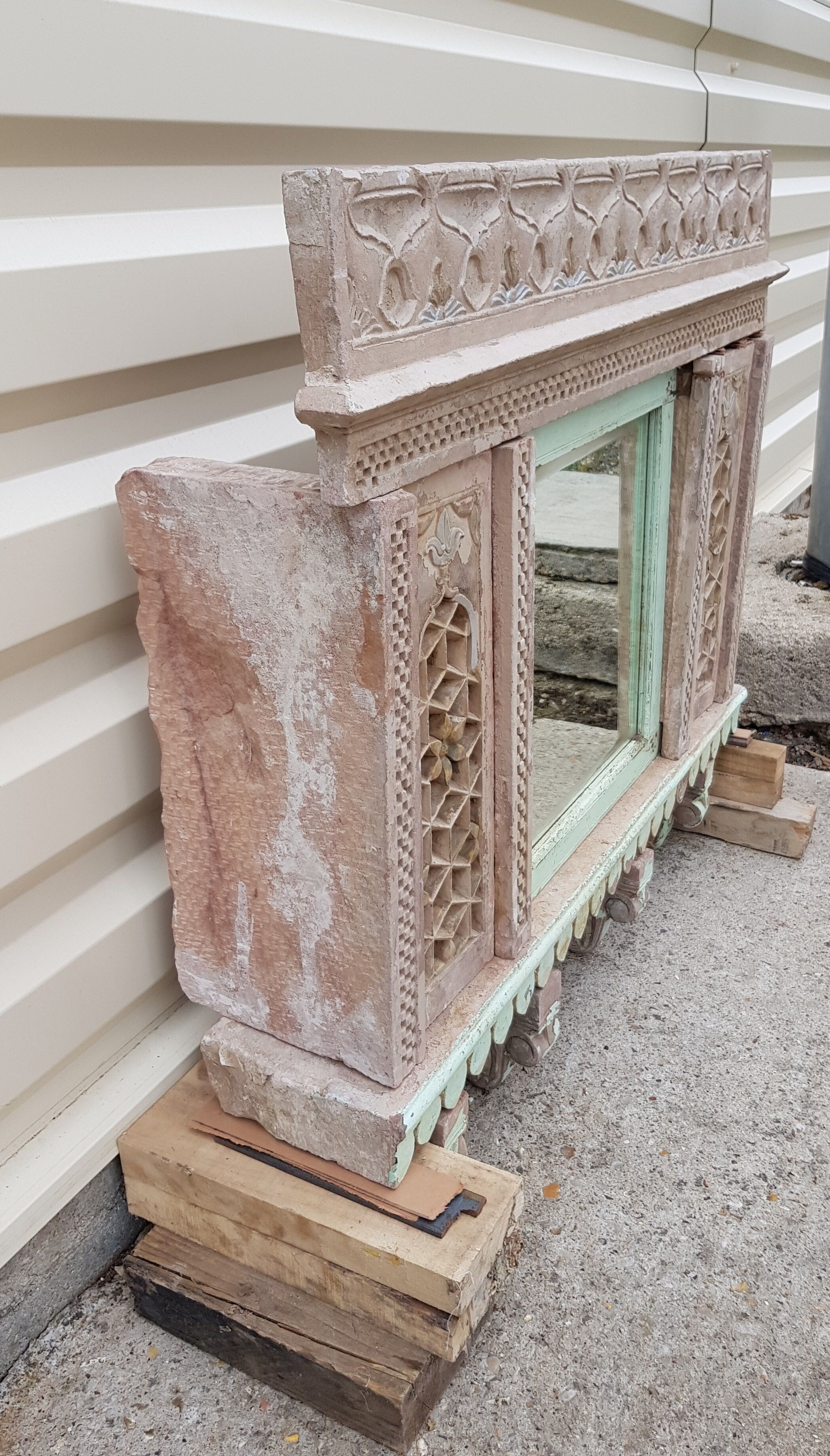 Fully hand-carved stone window with mirror