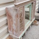 Fully hand-carved stone window with mirror
