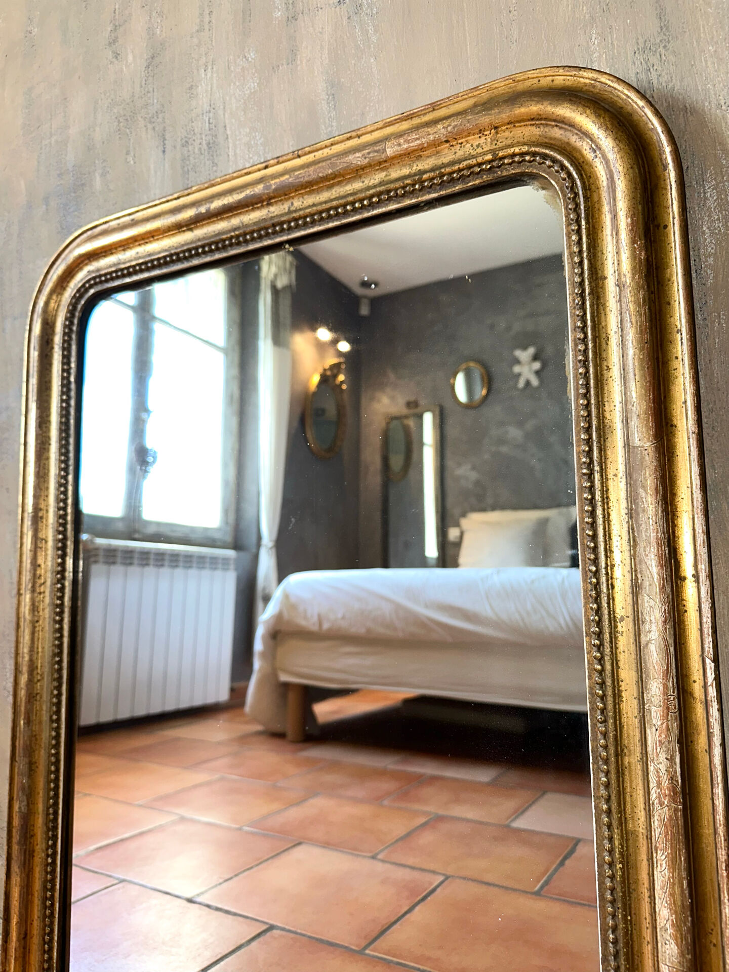 Antique Louis-Philippe gilded mirror from the 19th century.