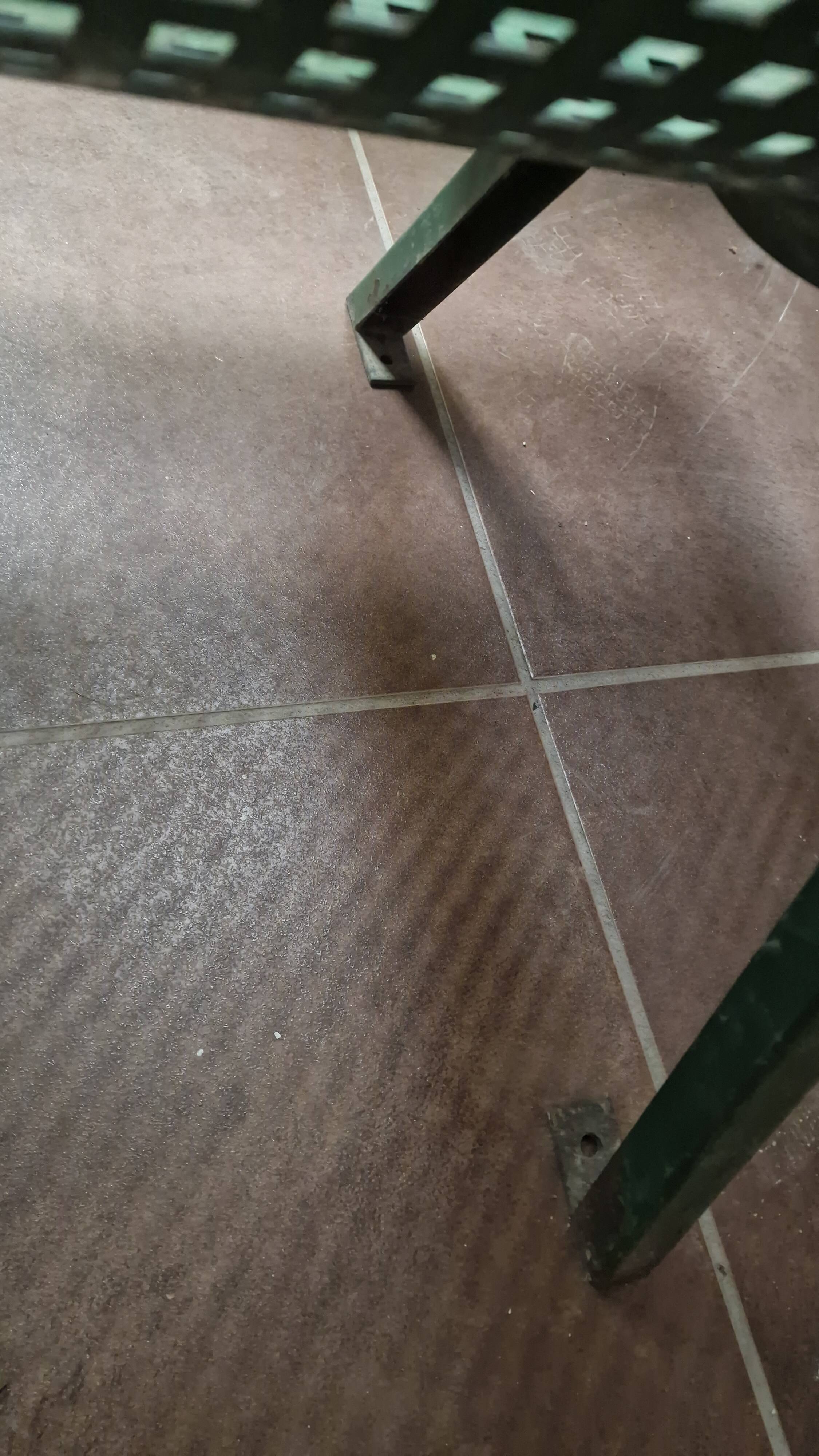 Vintage green perforated metal public bench