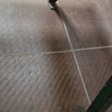 Vintage green perforated metal public bench