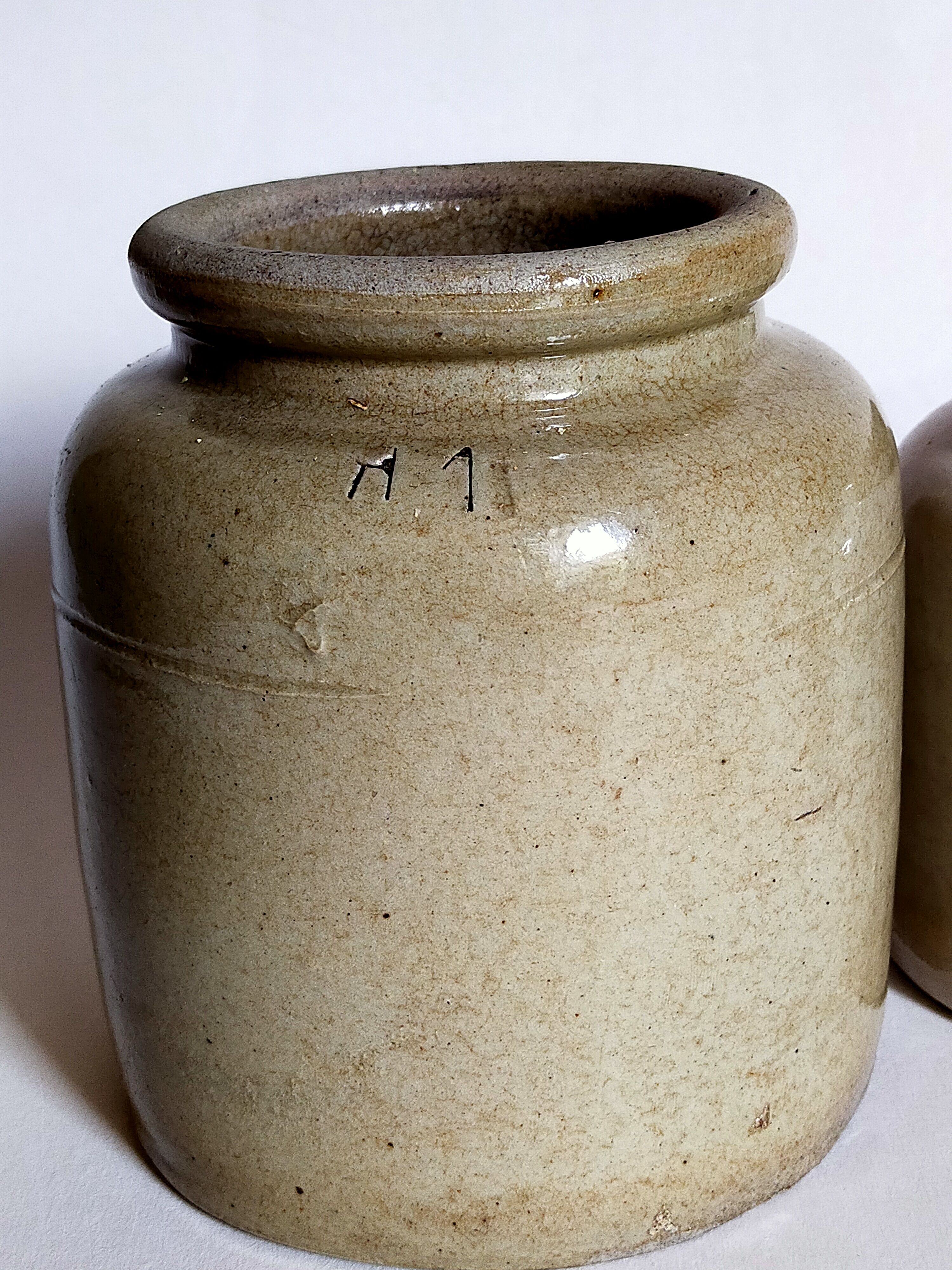 Set of three pots with old condiments in glazed earth