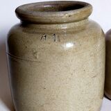 Set of three pots with old condiments in glazed earth