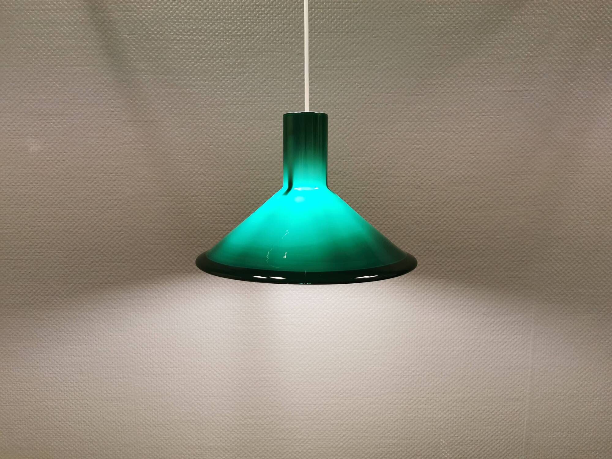 Green glass hanging lamp in double layer glass. Designed by Michael Bang for Holmegaard Denmark 1972