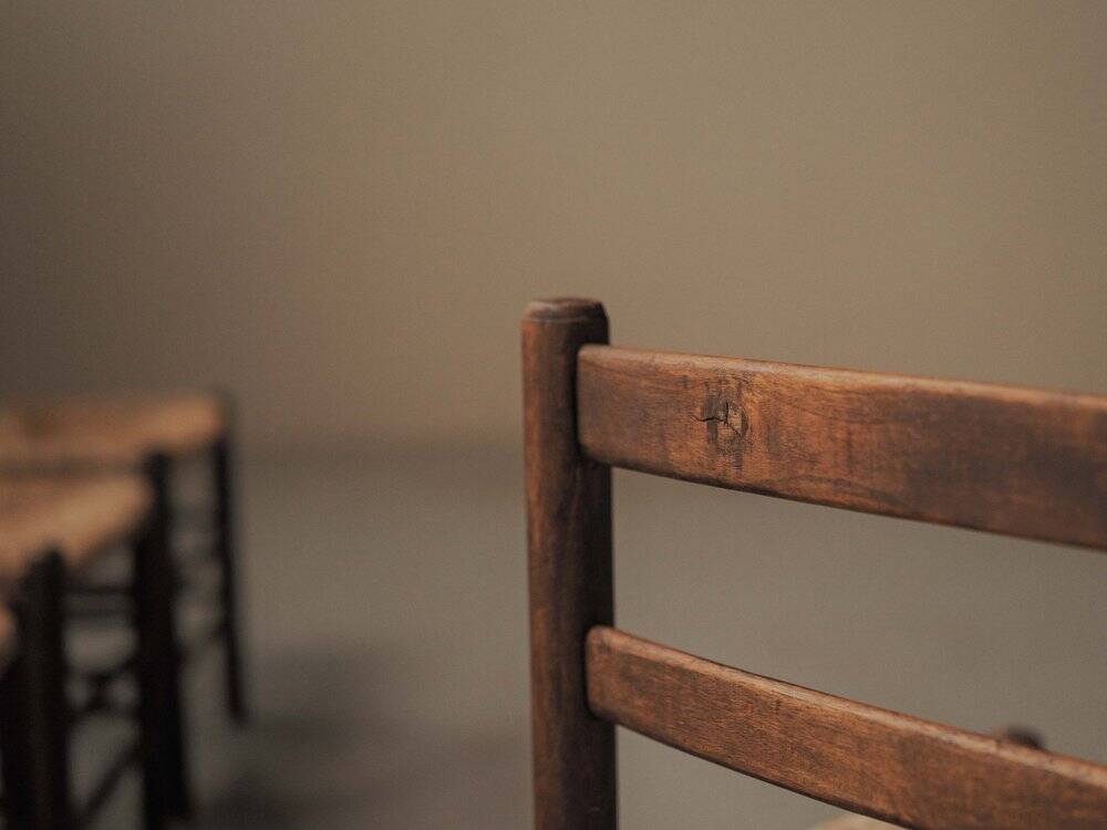 Set of four wooden and straw chairs, around 1960.