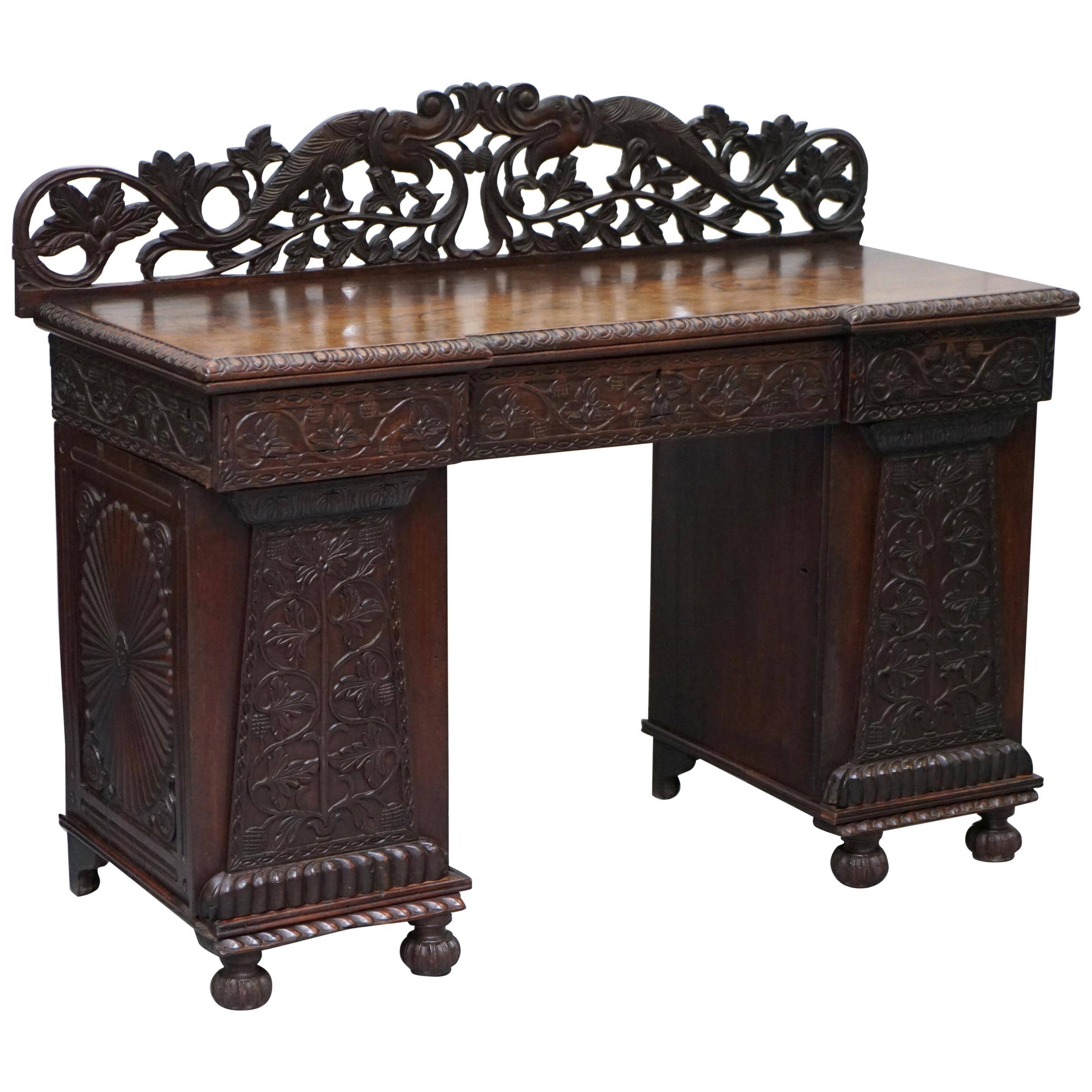 19th-century hand-carved Anglo-Burmese buffet with drawers and cupboards.