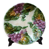Old barbotine plate with vine motif