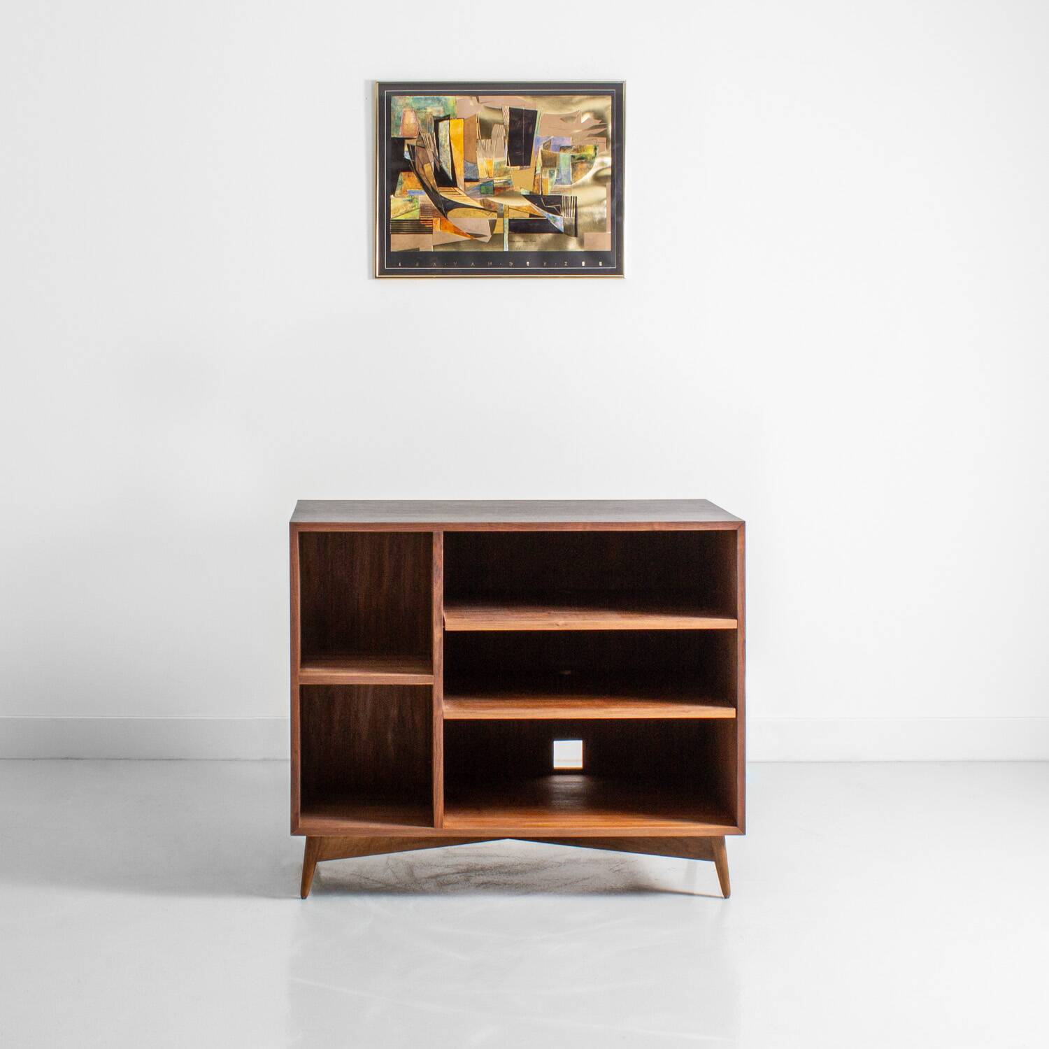 Chest of drawers in walnut and black paint, solid walnut base