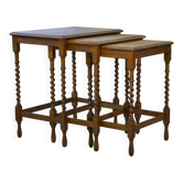 Rustic nesting tables in oak from the 1950s.
