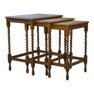 Rustic nesting tables in oak from the 1950s.