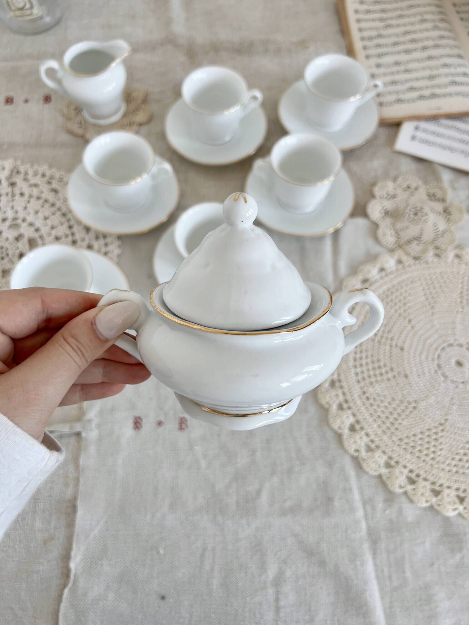 Vintage porcelain tea/coffee service with gold edging for 6 people, sugar bowl and milk jug