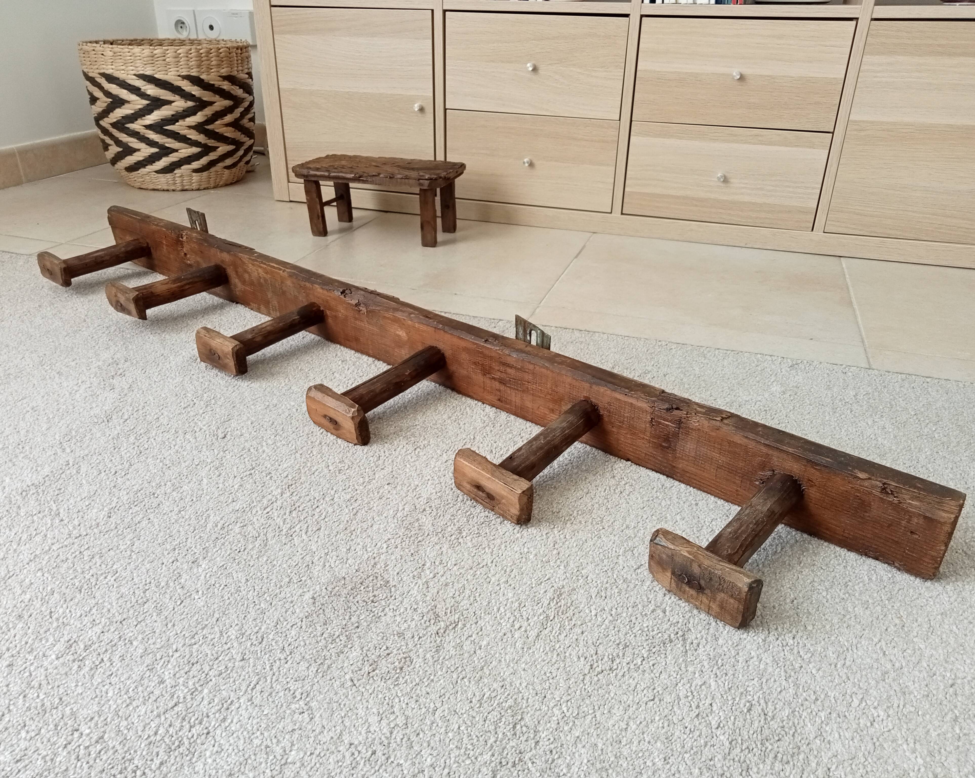 Old wall-mounted coat rack from a stable, folk art.