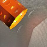 Danish Space-Age hanging lamp from the 80s, made in orange metal with cut-outs.