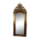 Large antique baroque mirror with angel decorations.