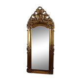 Large antique baroque mirror with angel decorations.