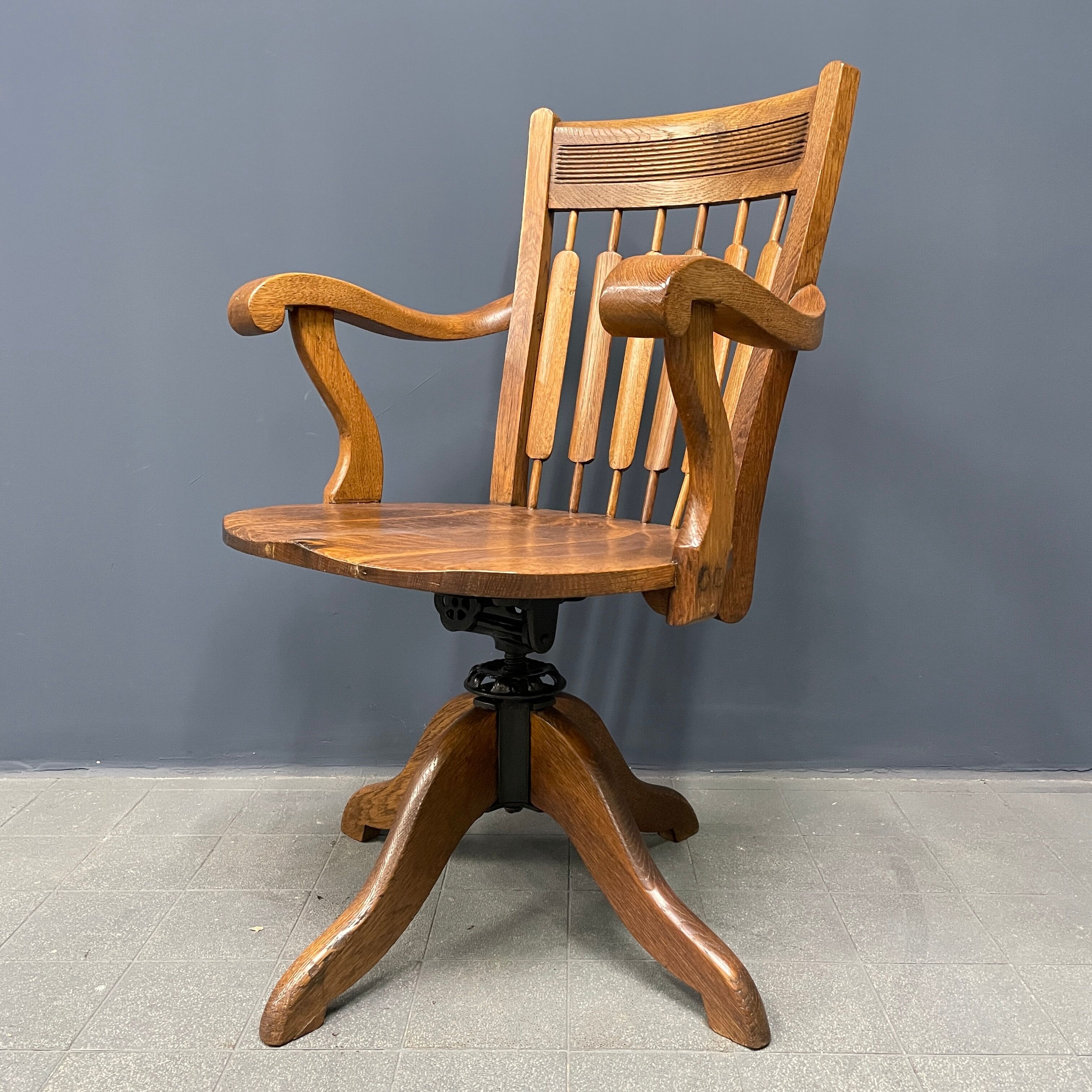 Antique American oak office chair with armrests 1920s