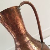 Pitcher-shaped vase in hammered copper