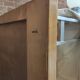 Modernist wall-mounted cloakroom in teak
