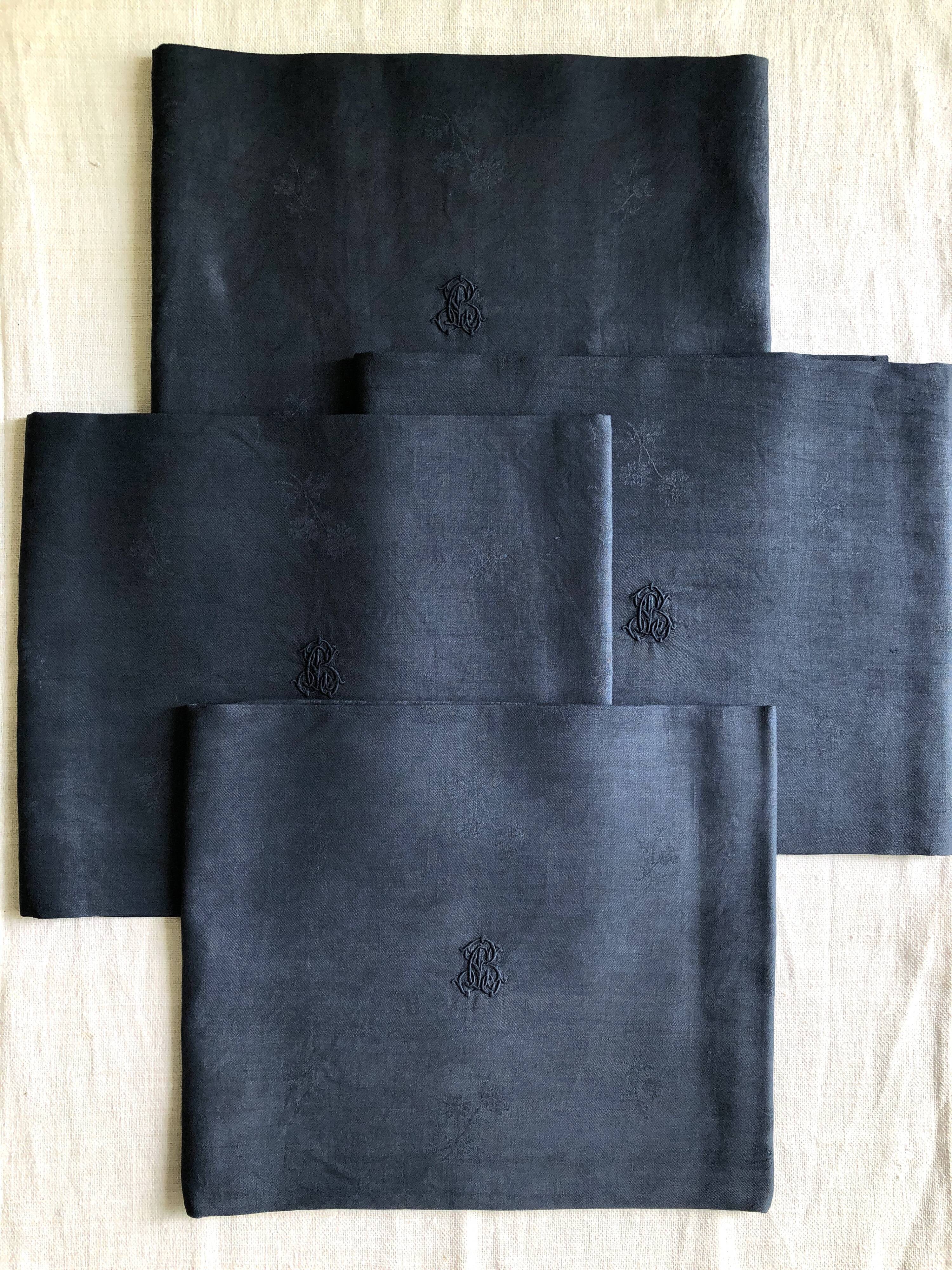 Lot four damasked and monogrammed towels linen and night blue silk